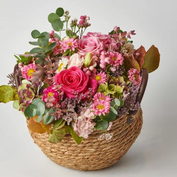 Composition with Fresh Seasonal Flowers in a Wicker Basket FLOWER ARRANGEMENTS Antheon